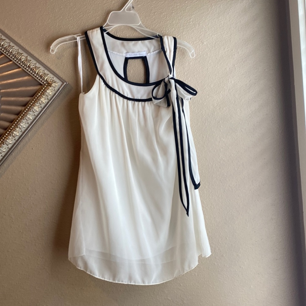 Black and cream sheer sleeveless blouse